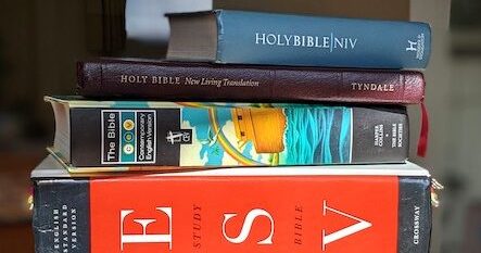 Different versions of the Bible piled up