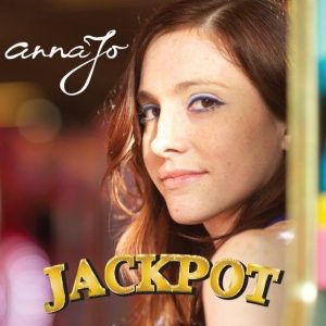 Jackpot cover, showing a closeup of annaJo in a casino with bright lights all around