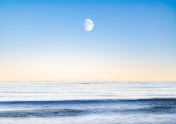 The sky and the sea image - calm sea with moon in sunset sky