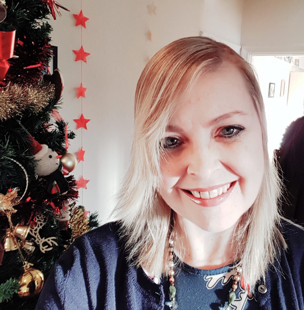 Picture of E.M. Carter, a smiling woman with long blonde hair